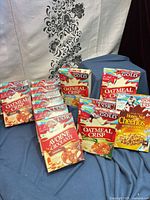 group of sealed Olympic edition cereal boxes including Oatmeal Crisp and Honey Nut Cheerios