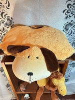 Dog pillow plush front view on shelf