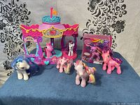 All items together showing carousel and seven pony figures