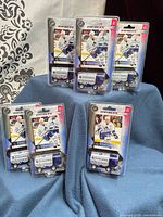 Six blister-packed Toronto Maple Leafs Zamboni toys displayed