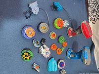 Overall lot showing controllers, ripcord launcher and twelve tops
