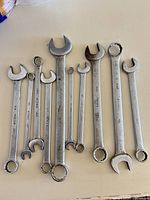 All ten combination wrenches laid out showing open and box ends