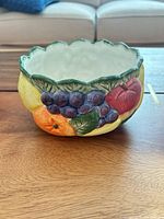 Front view of bowl showing fruit relief