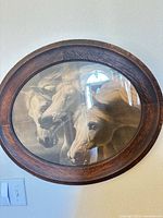 Front view showing horse print, oval wood frame, glass