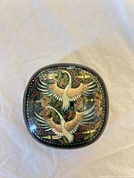 Top view of lacquer box showing crane artwork and overall shape