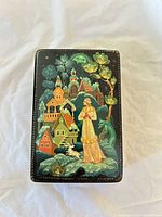 Top view showing full painted scene on lid