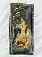 Top view of box showing Snow Princess scene and gold border