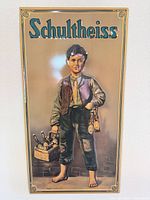 Front view of Schultheiss embossed tin sign showing full artwork and lettering
