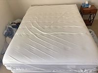 Top view of Sealy queen mattress with white surface