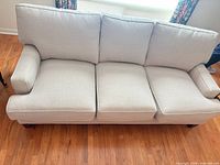 Front view three-seat sofa showing cushions and color