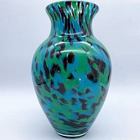 Front view of turquoise, green, blue confetti art glass vase