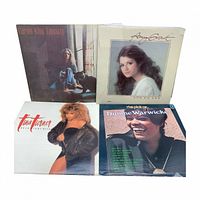 Front covers of all four albums