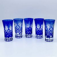Five cobalt blue cut-to-clear crystal glasses upright front view