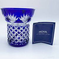 Front of blue cut crystal Hoya vase with booklet