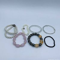 All seven bracelets laid out showing variety