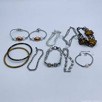 Group shot of all ten bracelets laid out