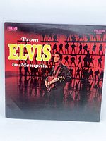 Front cover of From Elvis in Memphis LP showing Elvis with guitar