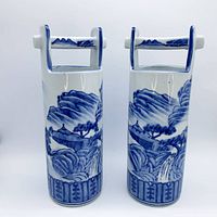 Front view of both vases showing scenic decoration and handles