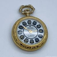 Front view of pocket watch showing full case, crown and bow