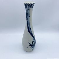 Front view of porcelain bud vase showing bamboo design