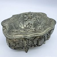 Front angled view showing overall form, embossed design and feet