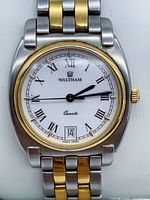 Front view of Waltham two-tone wristwatch showing dial, bezel, bracelet