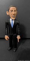 Front view of Obama figurine standing, arms at sides