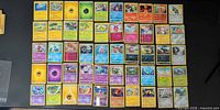 Full layout of 50 Pokémon cards in five rows showing variety of colours, types and rarities
