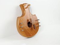 Front view showing overall shape, strings, mallets, sound hole