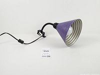 Lamp unplugged, full view of shade, arm, bracket, cord and switch