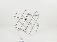 Front angled view of chrome wire wine rack showing X-form and overall design