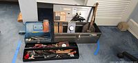 Overall lot showing open Vermont American toolbox, black plastic tray of hand tools and blue toolbox