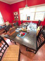 Wide view of dark wood dining table with custom top in dining room