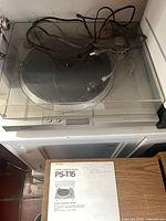 Sony PS-T15 turntable with dust cover and manual