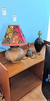 All three lamps on wooden stand