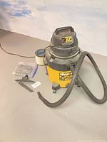Full view of Shop-Vac with hose, attachments and filter