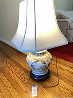 Full view of lit lamp with shade