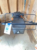 Top rear view showing grass collection bag and handle