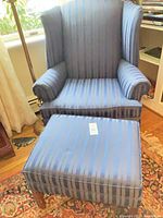 Wingback chair front view with matching footstool