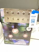 Front of boxed Ashland globe string lights set