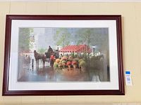 Framed print on wall showing full piece with frame and mat
