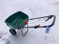 Full view of Scotts EdgeGuard spreader on snow