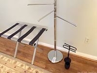 Overall lot: chrome towel rack, folding luggage stand, black hand towel stand, toothbrush holder