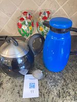 Group shot of wine glasses, kettle, carafe, infuser