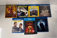 Front covers of seven Blu-ray cases