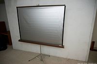 Front view of fully extended tripod projection screen