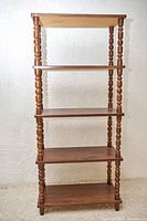 Full front view of brown MDF bookcase with five shelves