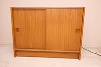 Front view of sideboard with both sliding doors closed