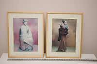 Both framed prints side by side showing frames, mats, subjects