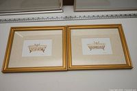 both framed bathtub prints side by side showing frames, mats and images
